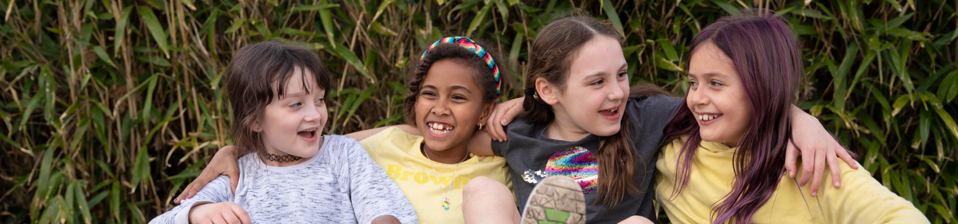  girl scout volunteer parent with young girl hiking outside at state park 