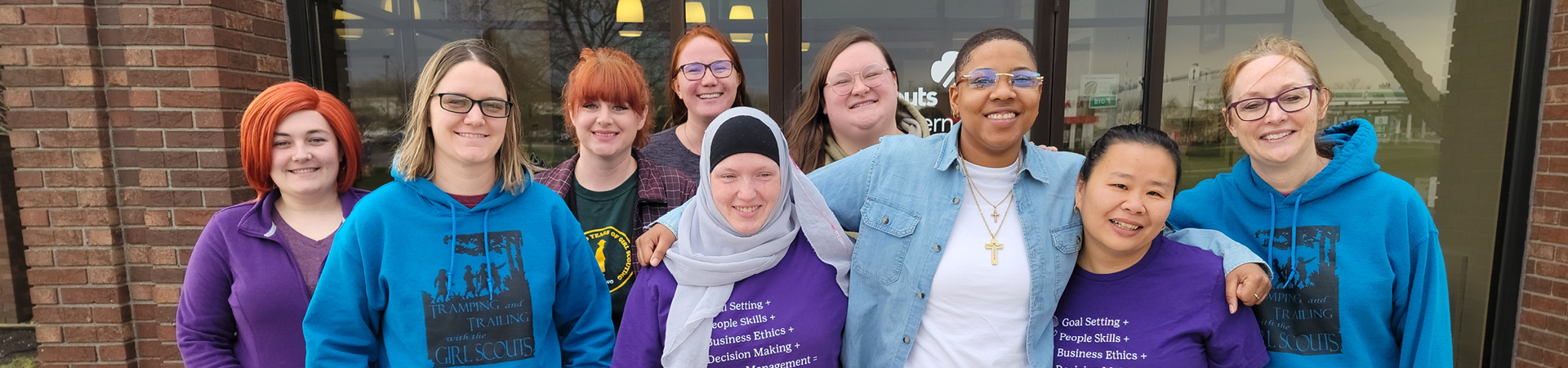  a diverse group of gswo staff standing in front of the toledo office 