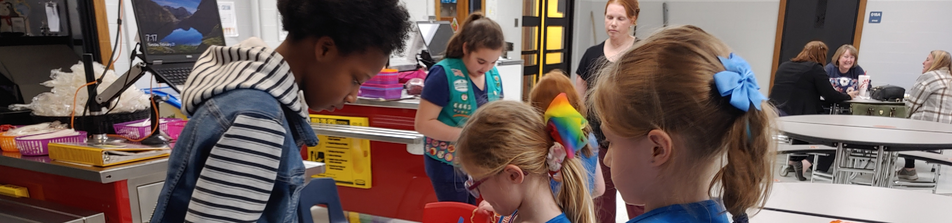 A group of Girl Scouts works diligently in a lab. 