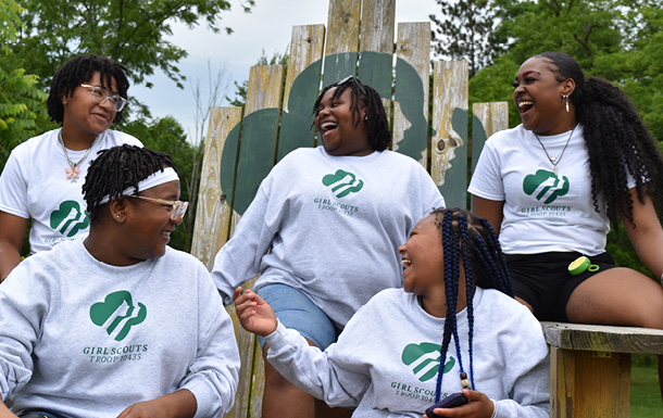A group of Girl Scouts on a giant chair