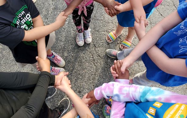 A group of girls holding hands