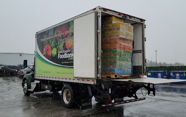 A foodbank truck loaded with Girl Scout cookies