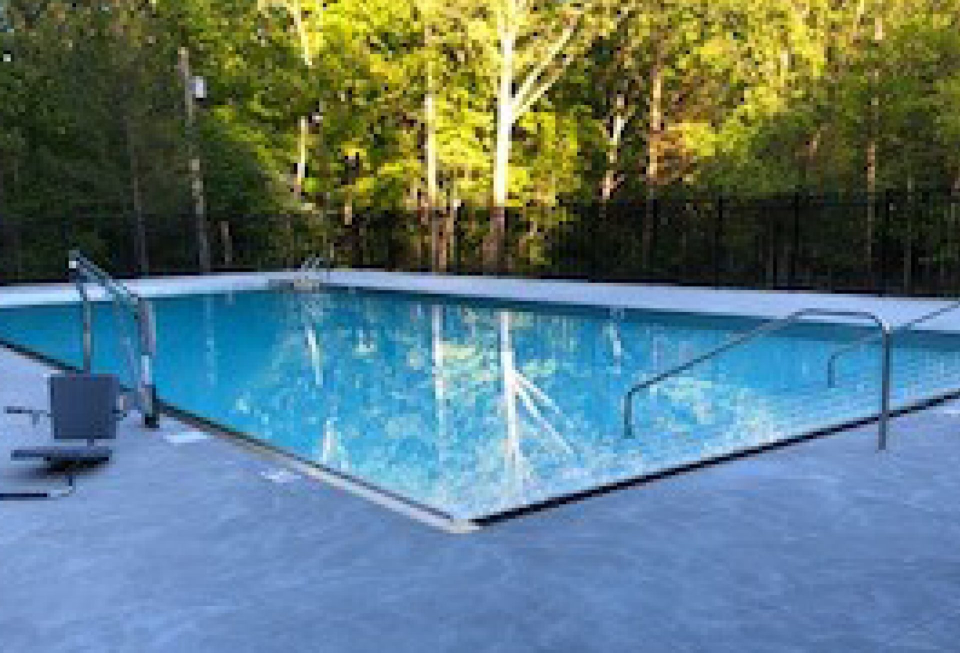 Sunlight reflecting off the water in the new pool at Camp Whip Poor Will